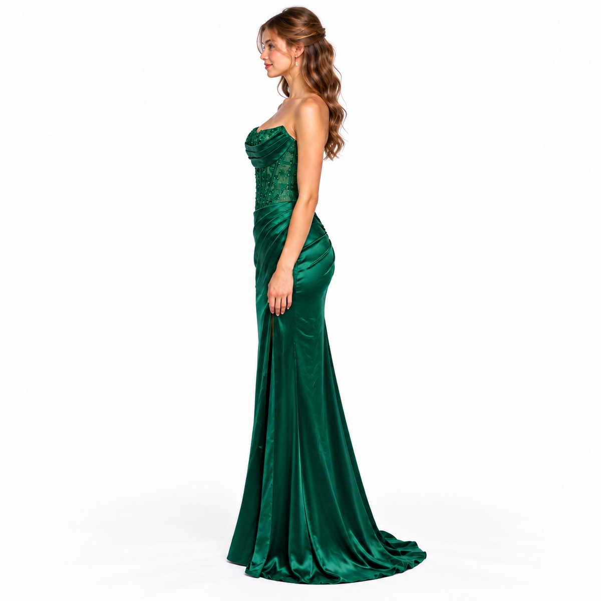 Side view of emerald green fitted prom gown with sweeping train