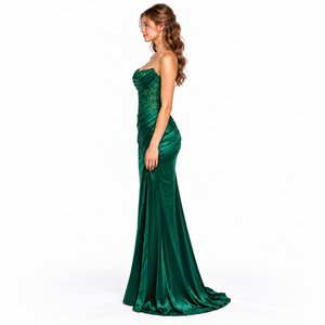 Side view of emerald green fitted prom gown with sweeping train